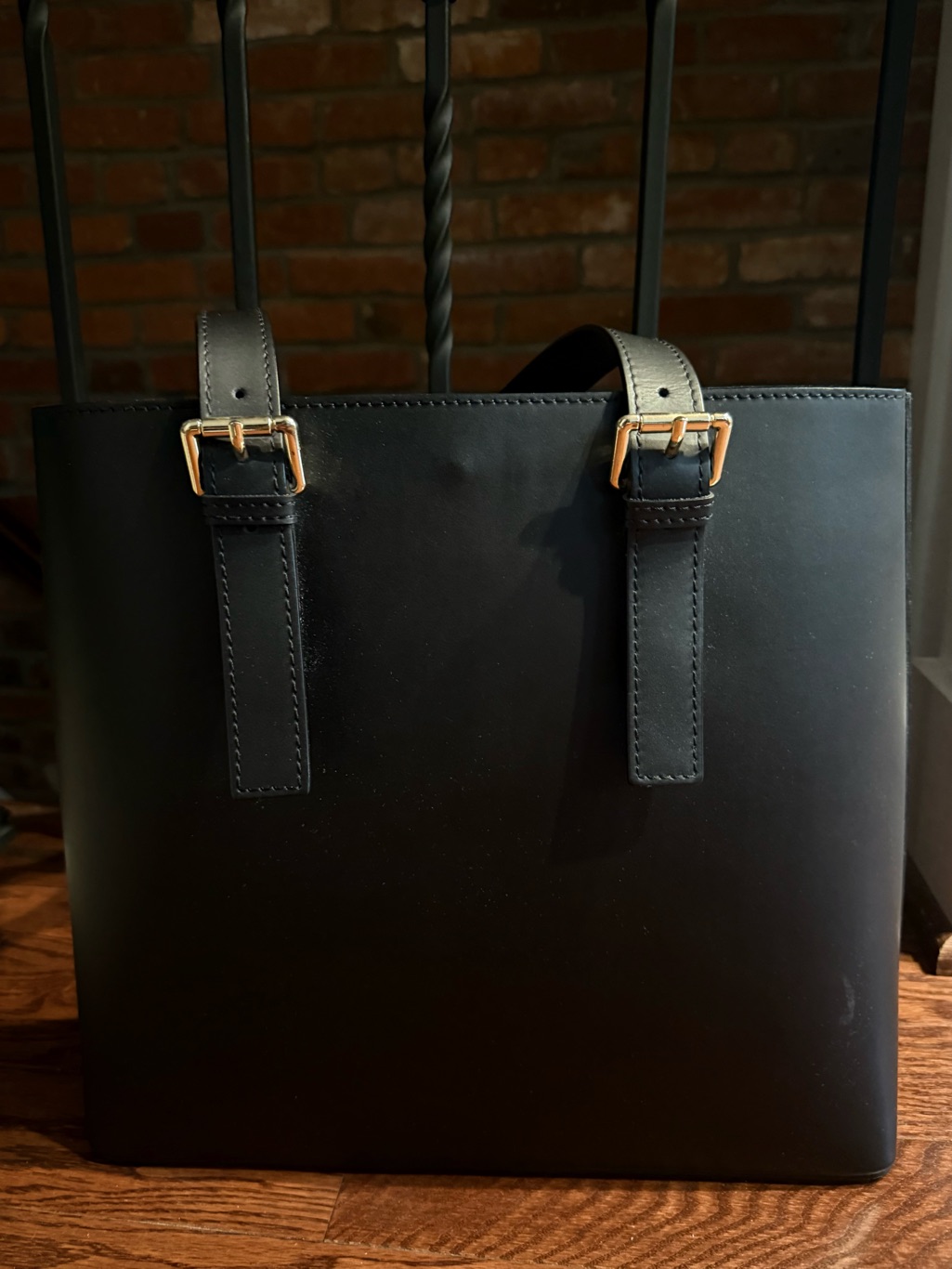 Structured Black Leather Tote With Gold Buckle Straps